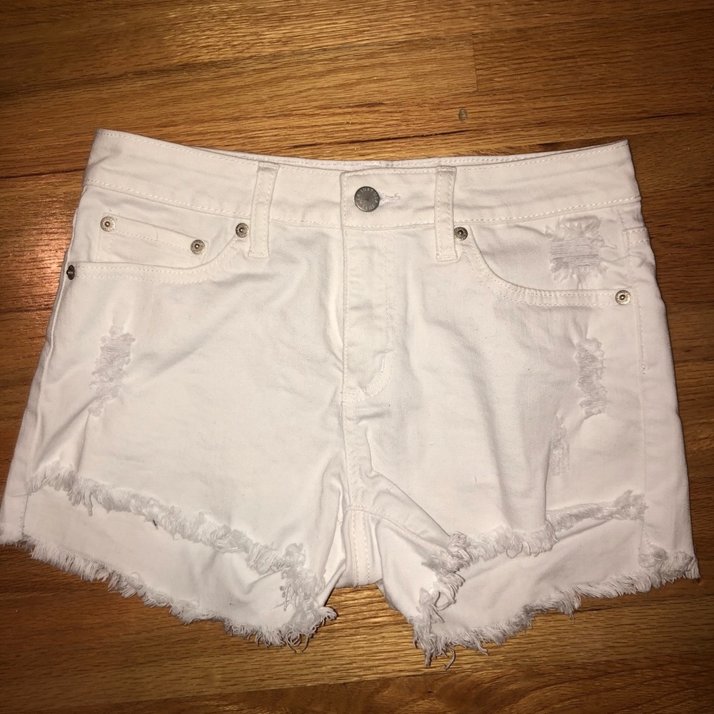 White ripped jean shorts